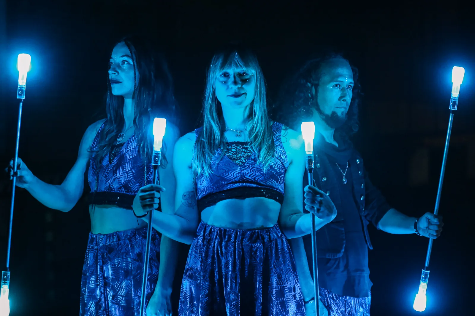 Trio portrait in blue LED light